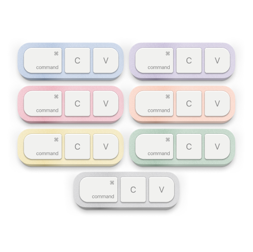 An arrangement of 7 Apple Magic Keys, a line of 3% keyboards with the keys Command, C and V. They come in blue, purple, red, orange, yellow, green and silver.